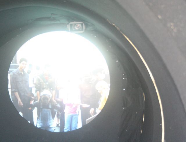 Londoners who paid 1 pound to look in the Telectroscope gaze enviously at New Yorkers, who get the view for free.